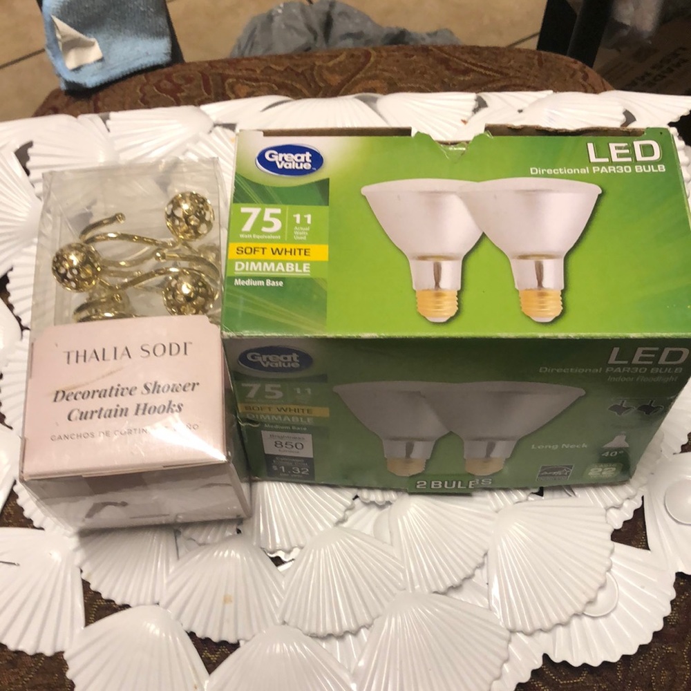 New shower curtain hooks, shower mat, and 2 unused (?) dimmable 75w like bulbs.